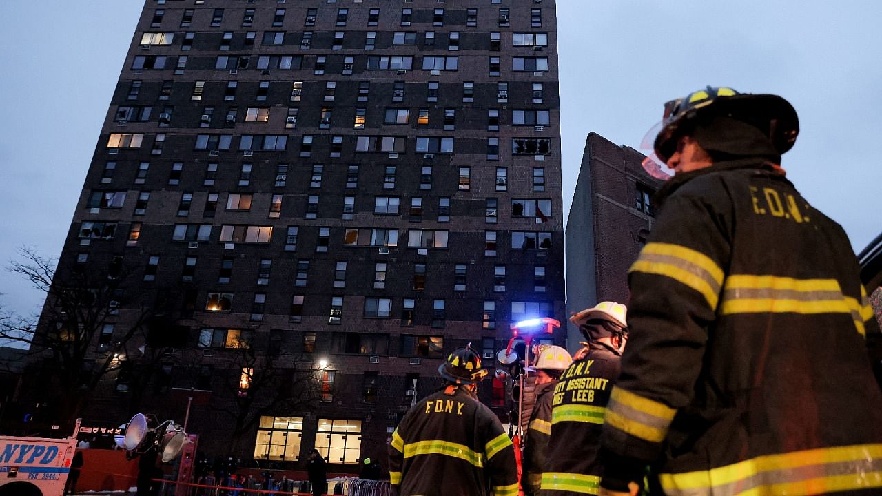 Emergency personnel from the New York City Fire Department (FDNY) respond to an apartment building fire in the Bronx borough. Credit: Reuters Photo