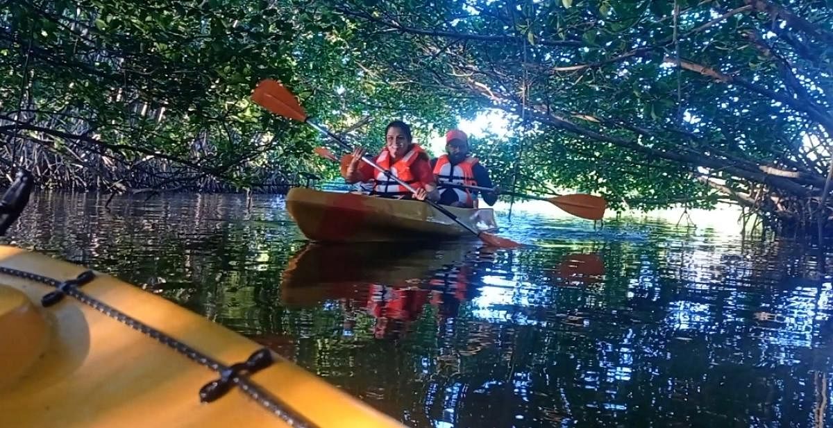 Visitors enjoy Kayaking in the backwaters of River Sita in Parampalli.