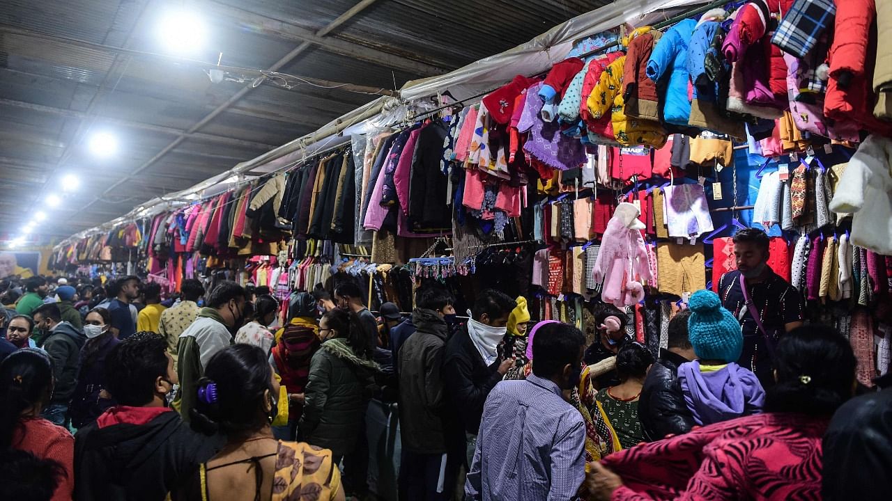 A file photo of people shopping at a market in Ahmedabad. Credit: AFP Photo