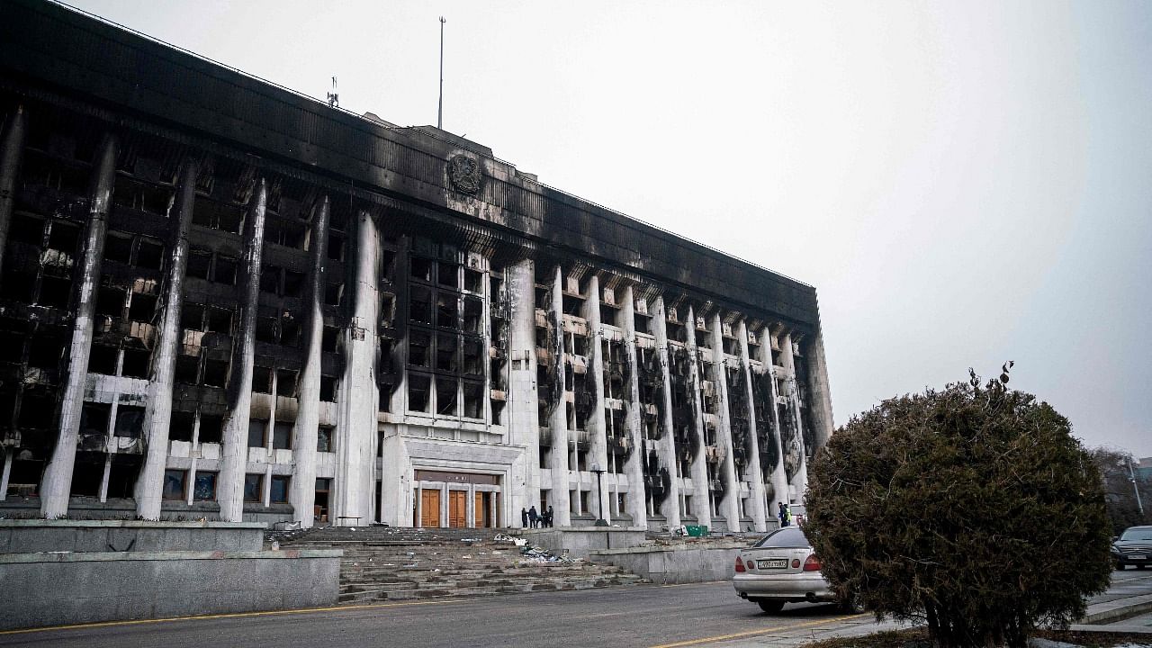 A burnt-out Almaty City Administration building in central Almaty, following violent protests over the price increase of the fuel. Credit: AFP Photo