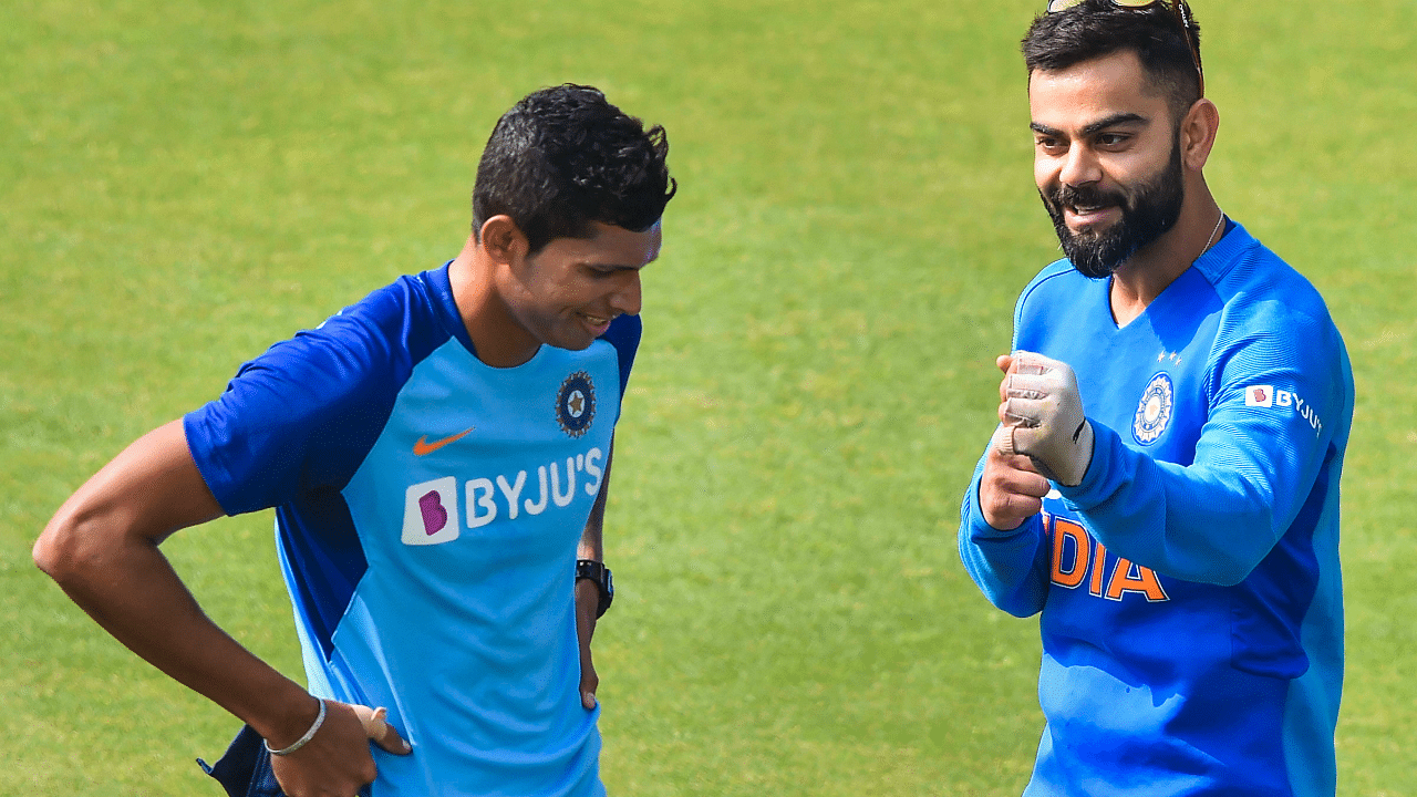 Indian skipper Virat Kohli with teammate Navdeep Saini. Credit: PTI Photo