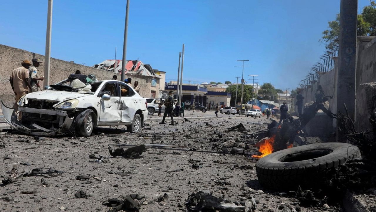 Somali security officers secure the scene of an explosion in the Hamarweyne district of Mogadishu. Credit: Reuters Photo
