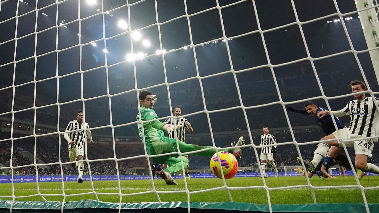 Alexis Sanchez scores their second goal. Credit: Reuters Photo