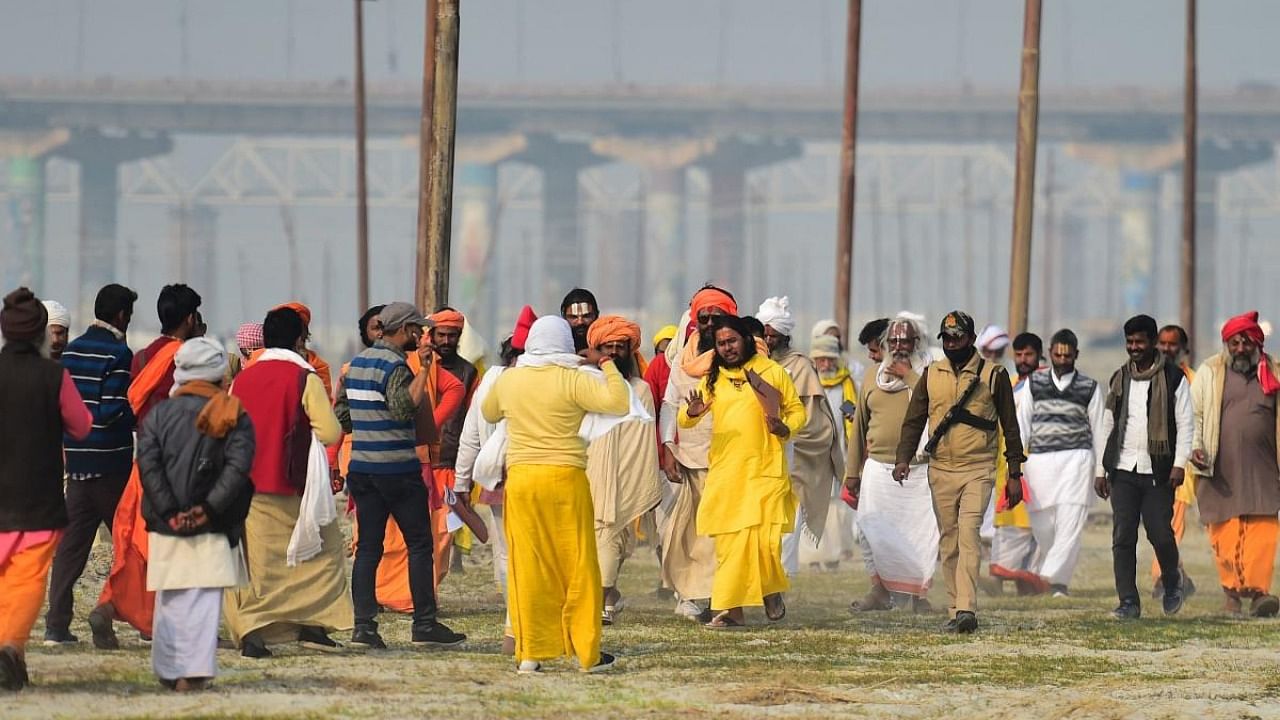 Sadhus or Hindu holymen arrive for the land allotment of temporary tents ahead of the Magh Mela festival in Allahabad on December 25, 2021. Credit: AFP Photo