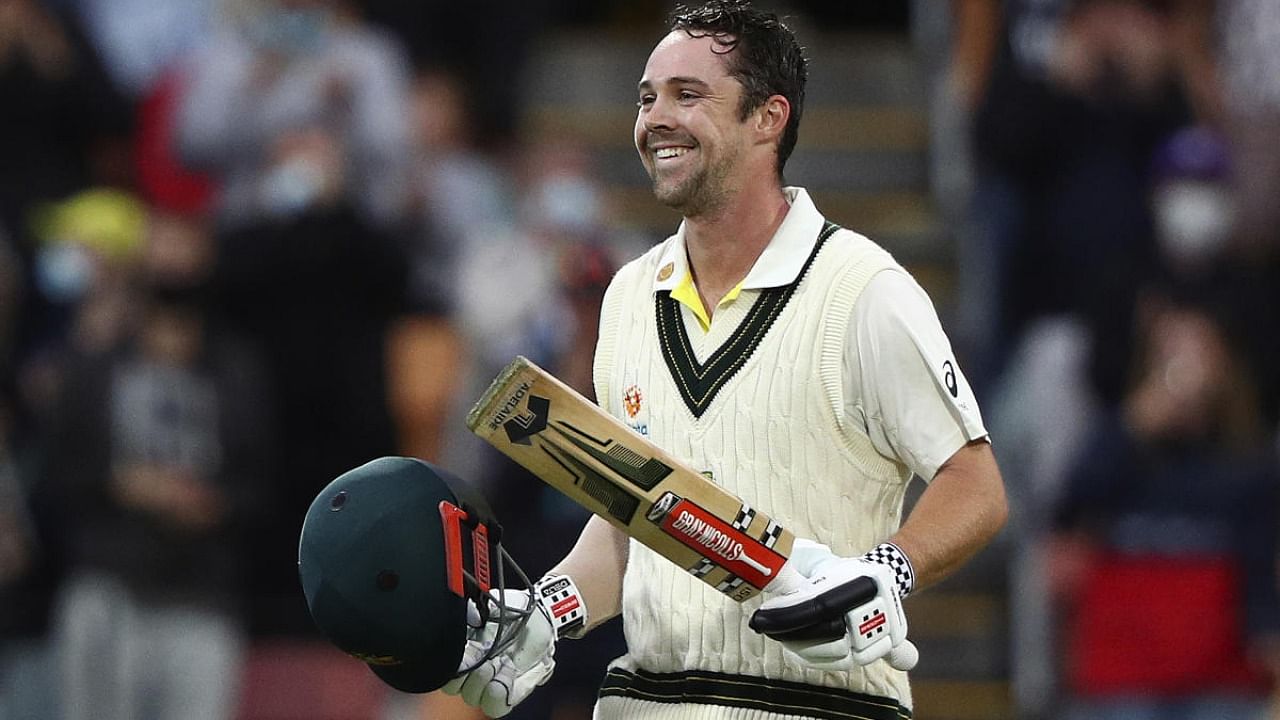  Australia's Travis Head celebrates making 100 runs against England during their Ashes cricket test match in Hobart. Credit: AP Photo