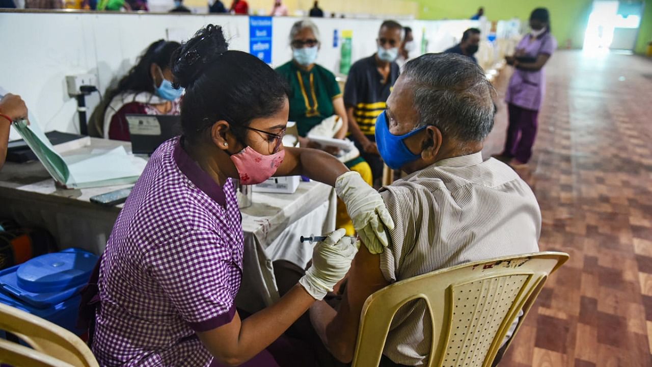 A nurse administers a booster dose of Covid-19 vaccine to a senior citizen in Mumbai. Credit: PTI Photo