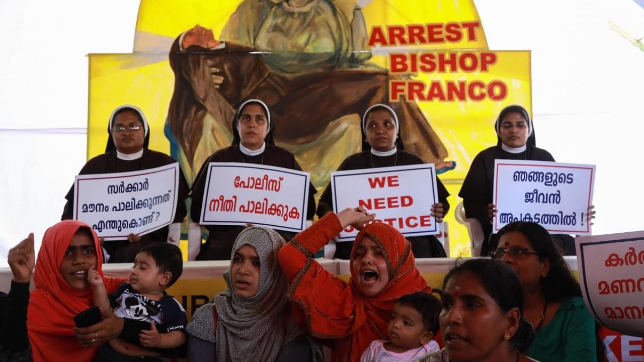 In this file photo taken on September 13, 2018 Indian Christian nuns and Muslim supporters protest as they demand the arrest of Bishop Franco Mulakkal, who is accused of raping a nun, outside the High Court in Kochi in Kerala. Credit: AFP file photo