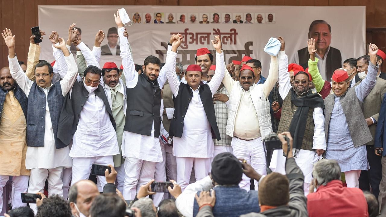 Former UP minister Swami Prasad Maurya and others join the Samajwadi Party in presence of party President Akhilesh Yadav at SP office in Lucknow. Credit: PTI photo