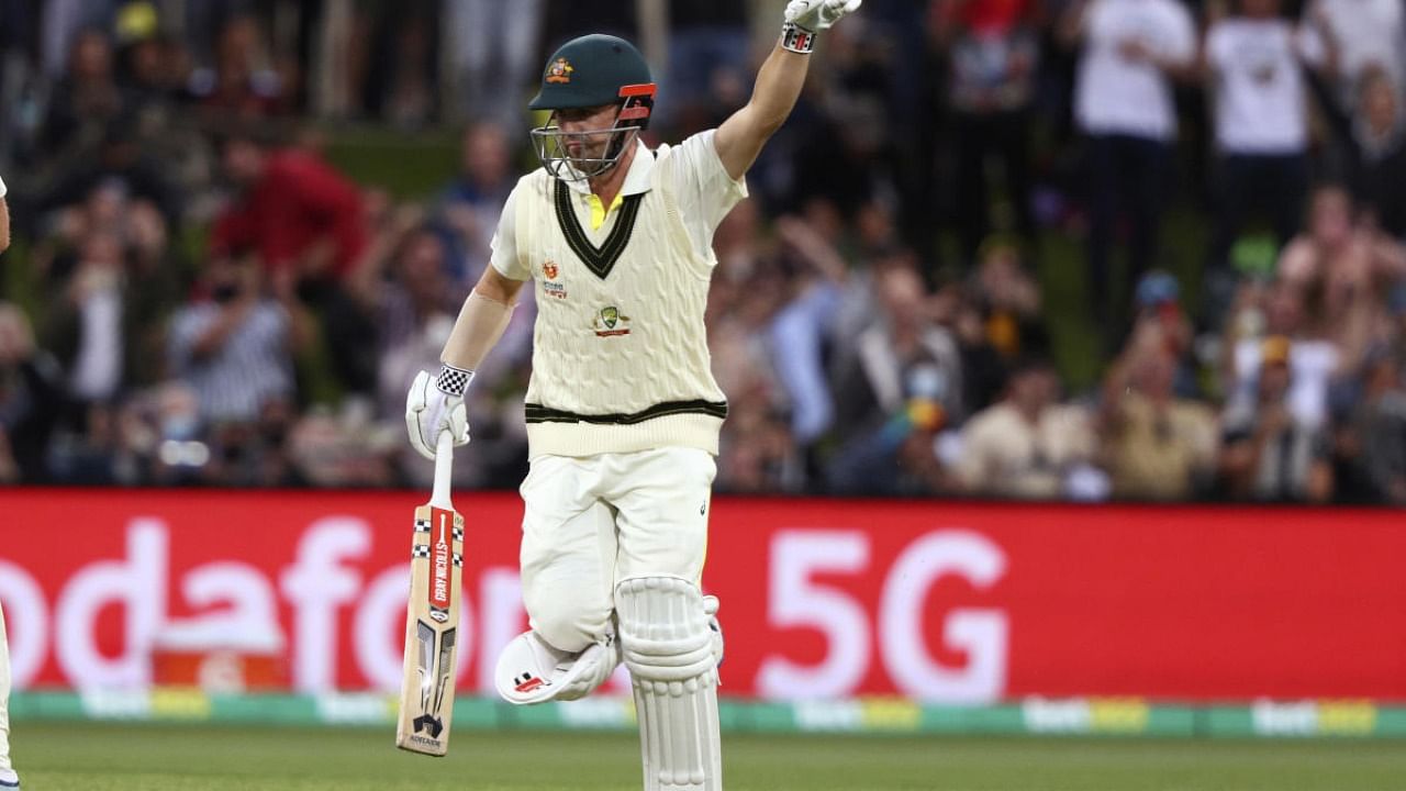 Australia's Travis Head celebrates making 100 runs against England during their Ashes cricket test match in Hobart. Credit: AP/PTI photo