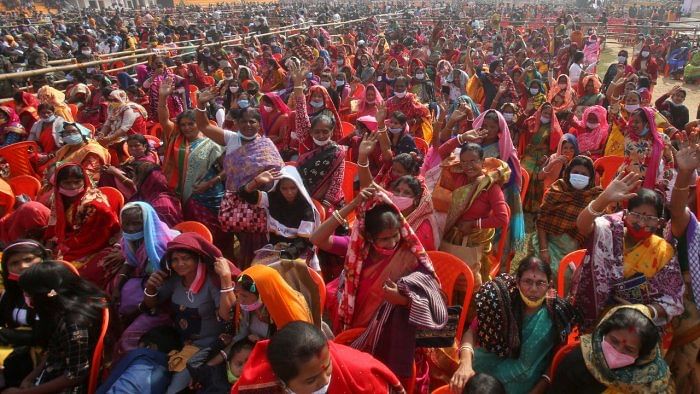 People wave as they attend a rally addressed by Prime Minister Narendra Modi, during the pandemic. Credit: Reuters File Photo