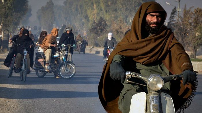 Motorists make their way along a road in Kandahar city on January 8, 2022. Credit: AFP File Photo