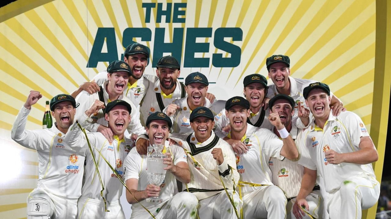  Australia celebrate winning the Ashes series with the trophy. Credit: Reuters Photo