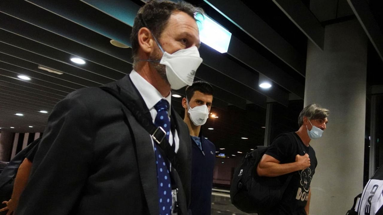 Serbian tennis player Novak Djokovic walks in Melbourne Airport before boarding a flight, after the Federal Court upheld a government decision to cancel his visa to play in the Australian Open, in Melbourne. Credit: Reuters photo