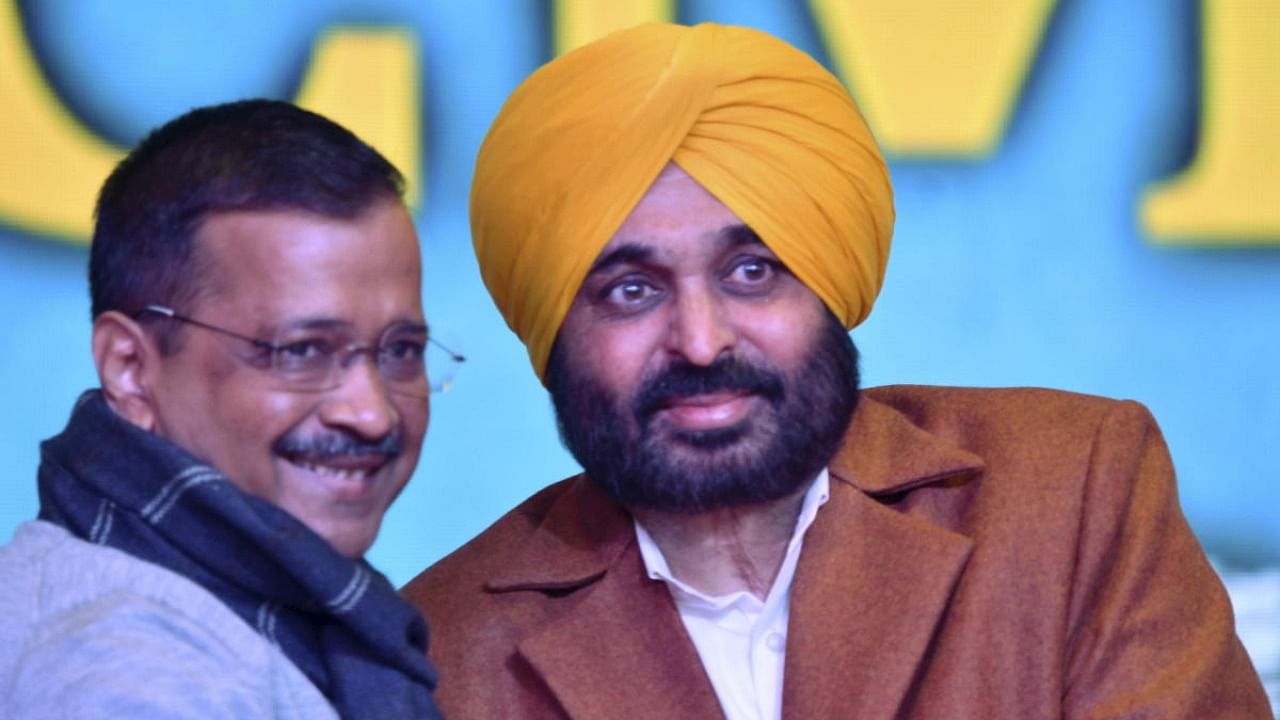 Delhi CM and AAP supremo Arvind Kejriwal with party's chief ministerial candidate Bhagwant Singh Mann ahead of Punjab polls, in Mohali. Credit: PTI Photo