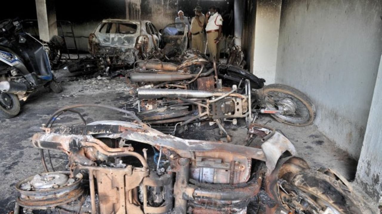 Rioters torched dozens of vehicles in DJ Halli and KG Halli areas of East Bengaluru on August 11, 2020. Credit: DH File Photo