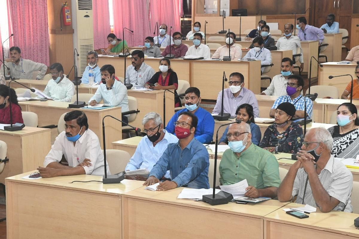 Activists including Dr Ravindranath Shanbhag (second from right), Sreedhar Gowda (third from right) at the meeting convened to review welfare schemes for victims of endosulfan poisoning at Netravathi Hall in DK ZP premises in Mangaluru on Monday.