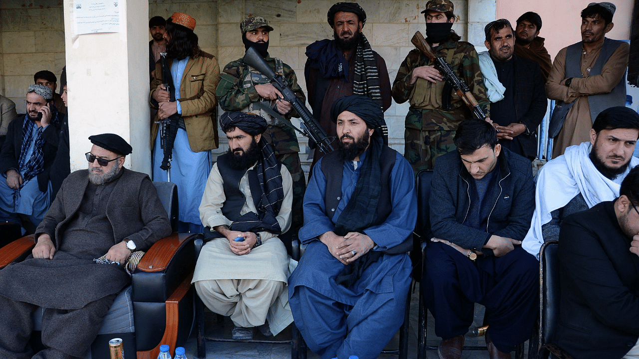 Taliban members watch a football match at the stadium in Kandahar. Credit: AFP Photo