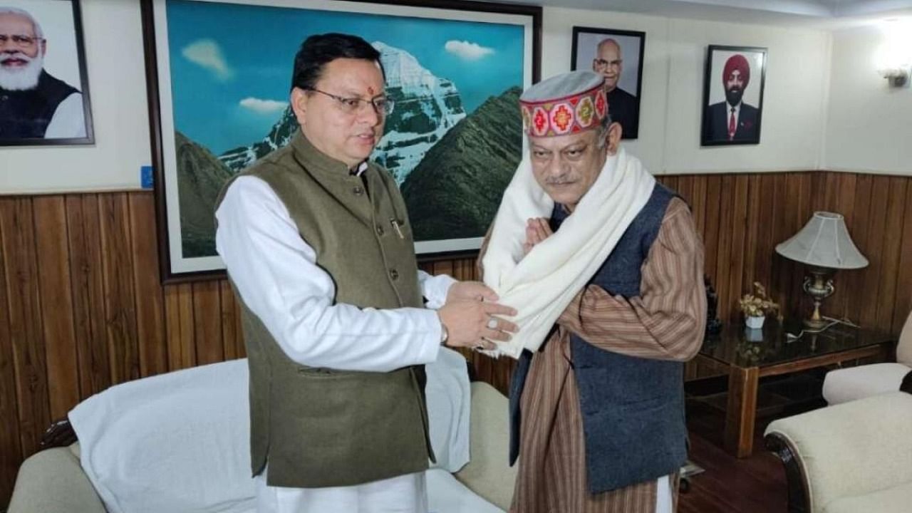 Vijay Rawat (right) with Uttarkhand CM Pushkar Singh Dhami. Credit: IANS photo