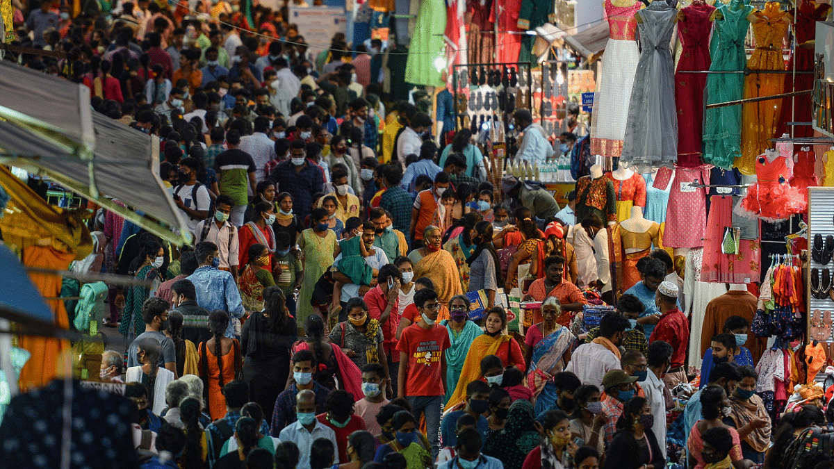Shoppers crowd at a commercial street ahead of a Sunday lockdown announced to curb the spread of Covid-19. Credit: PTI Photo