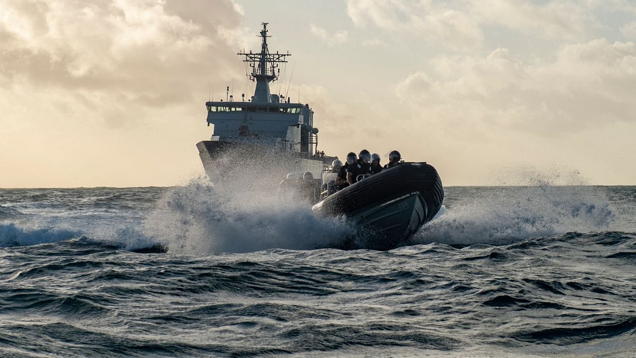 A handout photo taken on January 20, 2022 and released on January 21, shows HMNZS Wellington dispatching Hydrographic Survey and Dive Teams in Tonga following the eruption of the Hunga Tonga-Hunga Ha’apai undersea volcano on a nearby island on January 15. Credit: AFP Photo