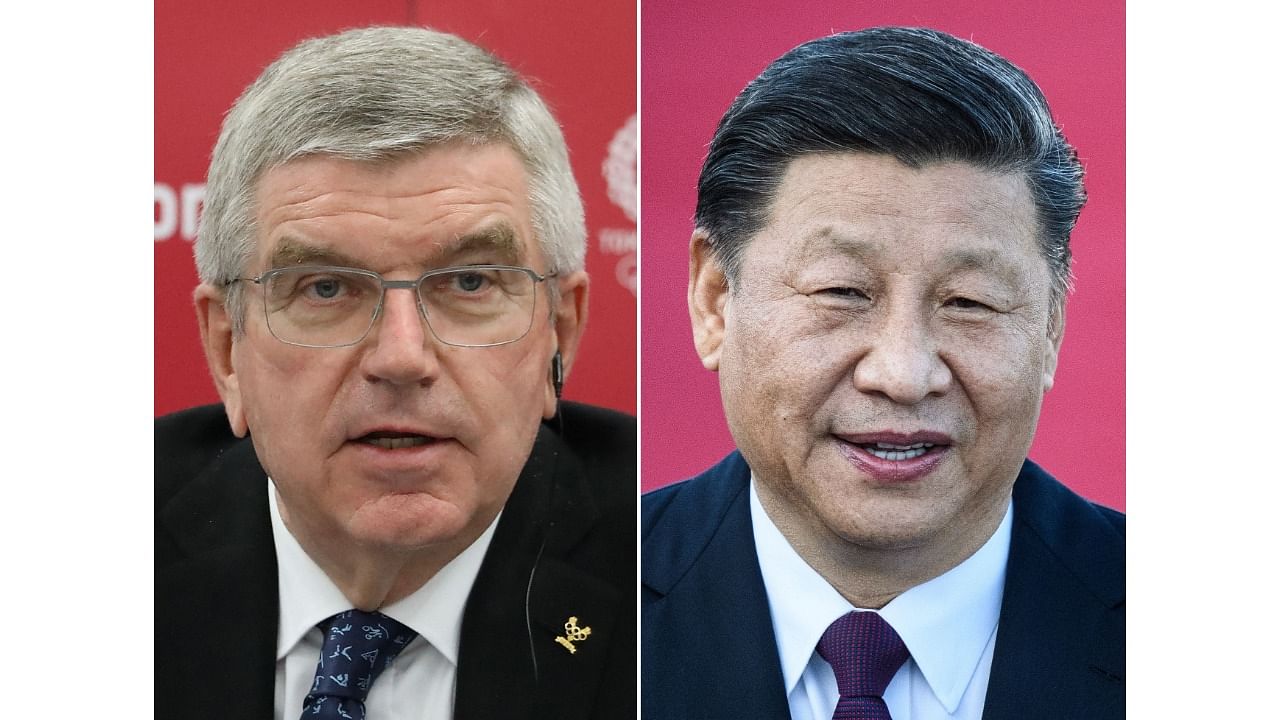 Olympic chief Thomas Bach and China's President Xi Jinping. Credit: AFP Photo