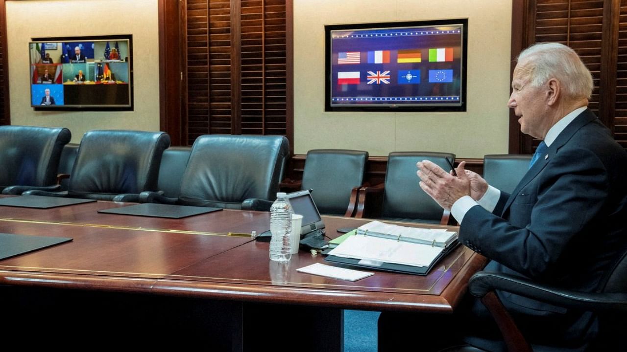 US President Joe Biden is seen in a White House handout photo as he speaks with European leaders about Russia and the situation in Ukraine during a secure video teleconference from the Situation Room of the White House in Washington, US. Credit: Reuters Photo