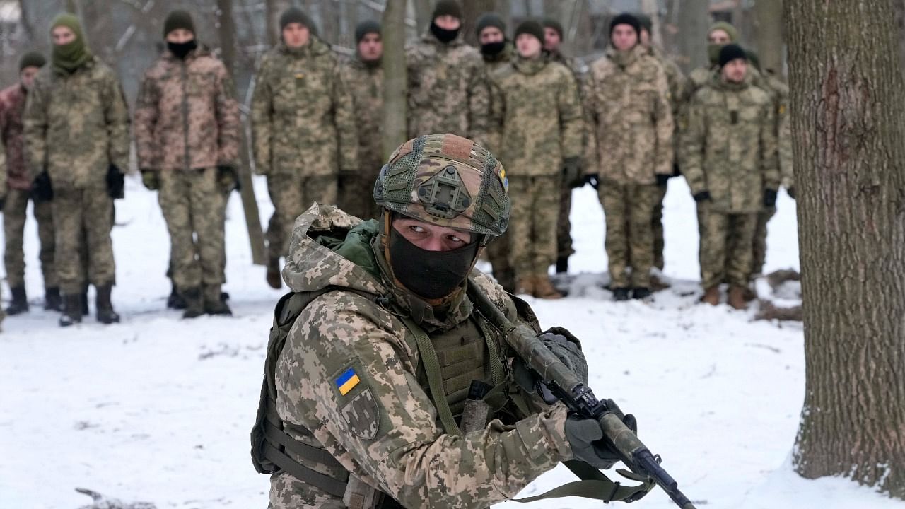An instructor trains members of Ukraine's Territorial Defense Forces, volunteer military units of the Armed Forces, in a city park in Kyiv, Ukraine. Credit: AP/PTI Photo