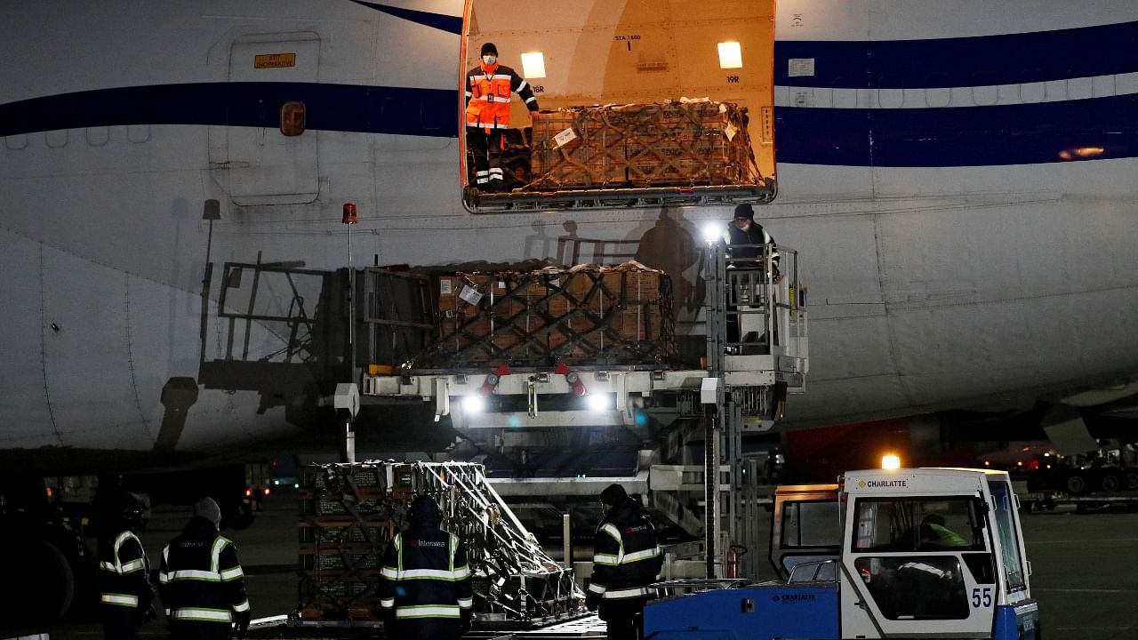 Workers unload a shipment of military aid delivered as part of the United States of America's security assistance to Ukraine. Credit: Reuters Photo