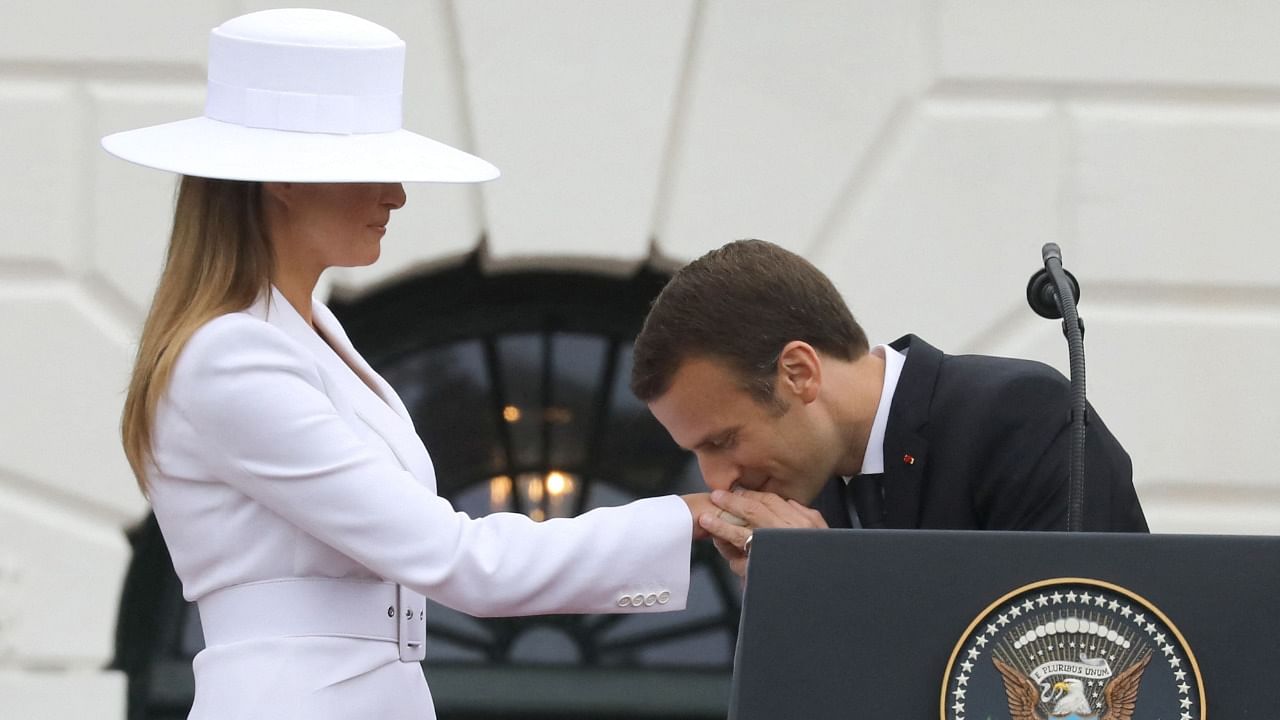 French President Emmanuel Macron greets the then First Lady of the US, Melania Trump, in 2018. Credit: AFP Photo
