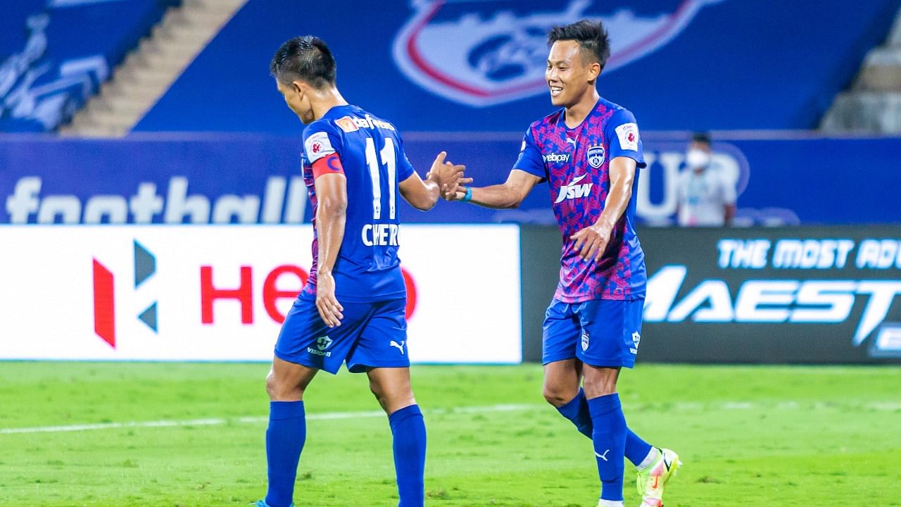 Bengaluru FC winger Udanta Singh (L) celebrates with skipper Sunil Chhetri after scoring his first goal during a 3-0 win over Chennaiyin FC. Credit: Twitter/@BengaluruFC
