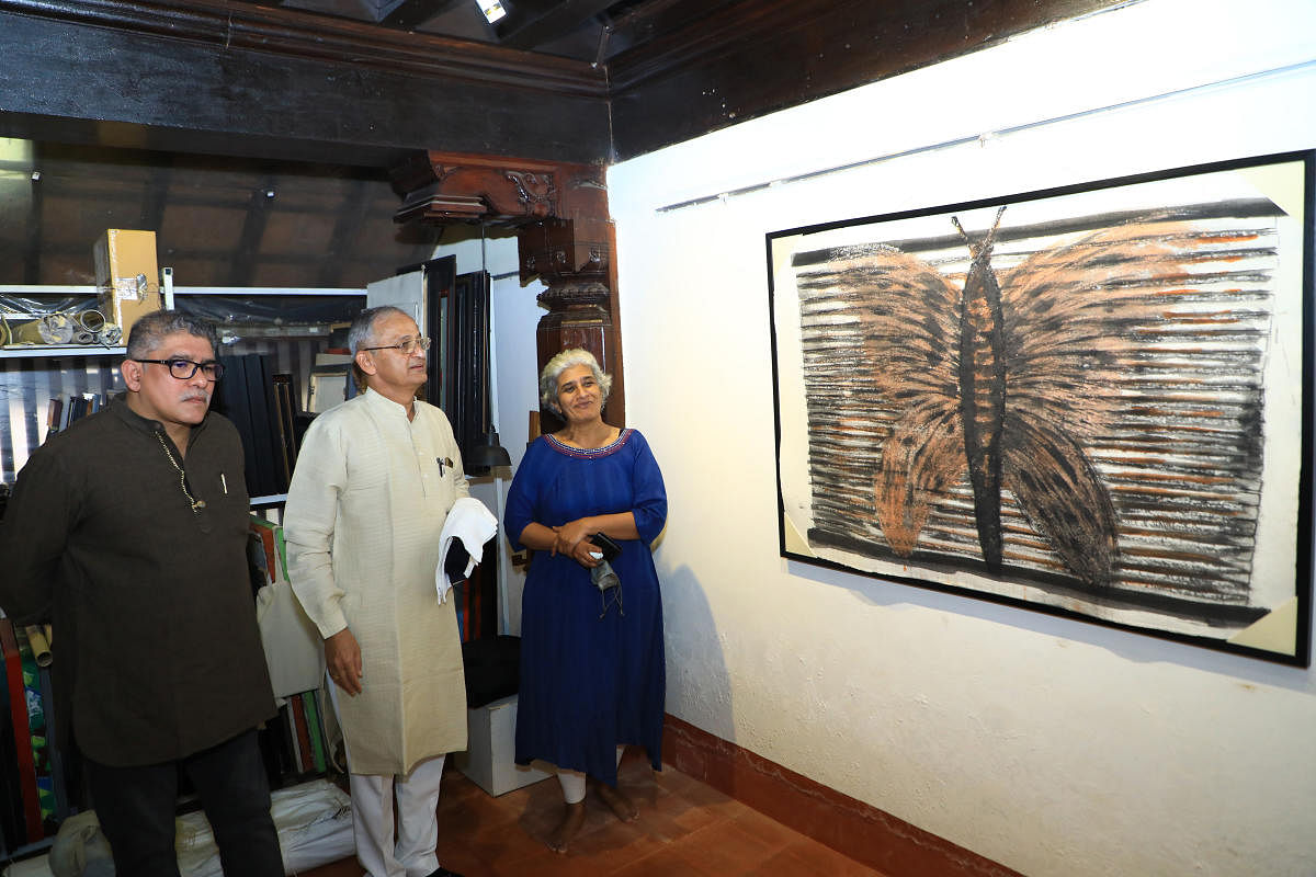 Former MLC Capt Ganesh Karnik looks at an artwork at the Kodialguthu Center for Art and Culture in Mangaluru.