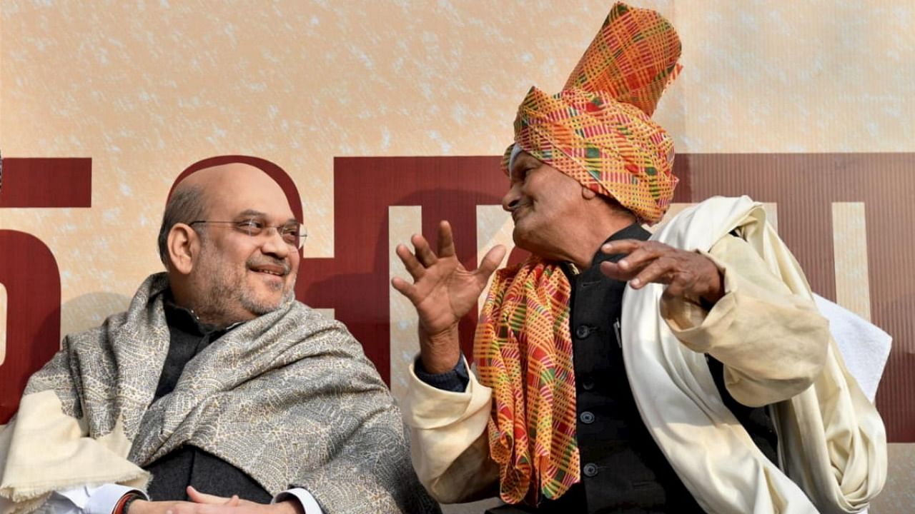 Union Home Minister Amit Shah with a senior Jat leader during his meeting with Jat leaders from UP, at BJP MP Parvesh Verma's residence in New Delhi. Credit: PTI Photo