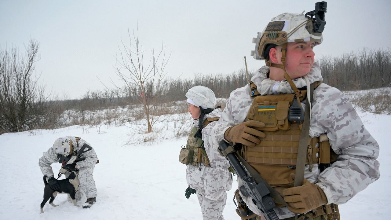 Service members of the Ukrainian armed forces are seen at combat positions near the line of separation from Russian-backed rebels outside the town of Avdiivka in Donetsk Region, Ukraine. Credit: Reuters File Photo