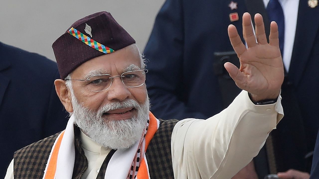 Prime Minister Narendra Modi dons an Uttarakhandi cap during the Republic Day function in New Delhi. Credit: Reuters Photo