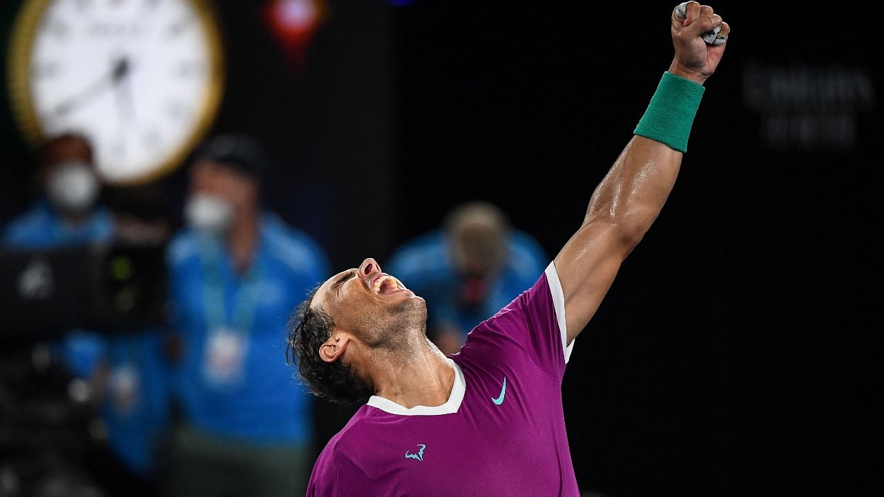 Spain's Rafael Nadal celebrates after victory against Italy's Matteo Berrettini during their men's singles semi-final match of the Australian Open. Credit: AFP Photo
