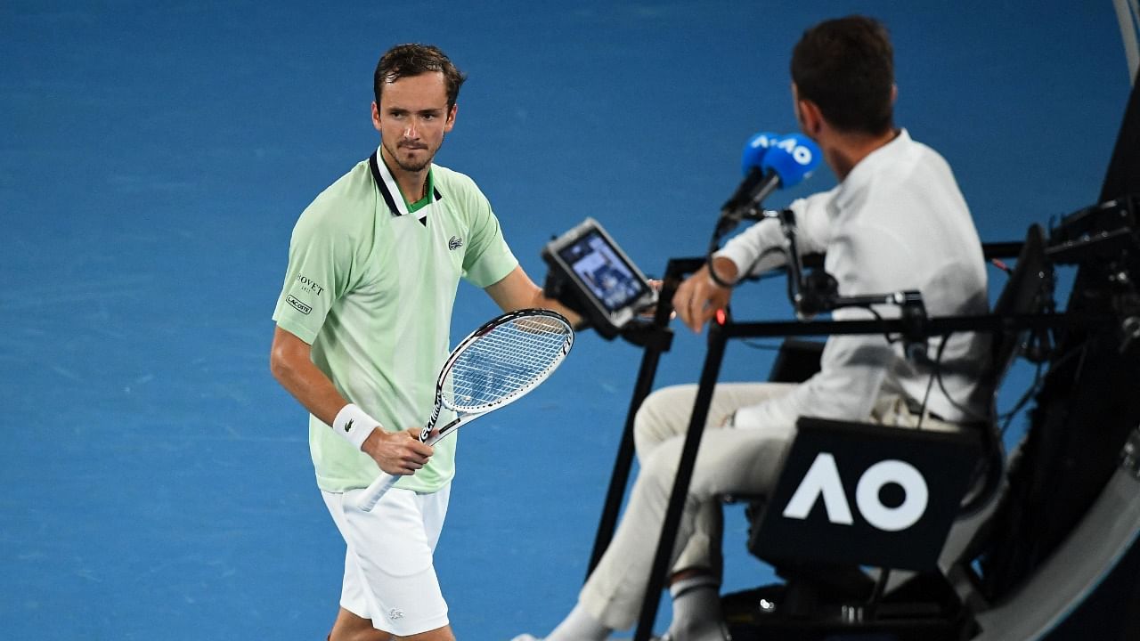 Russia's Daniil Medvedev walks past the umpire during his men's singles semi-final match against Greece's Stefanos Tsitsipas on day twelve of the Australian Open tennis tournament in Melbourne on January 28, 2022. Credit: AFP Photo