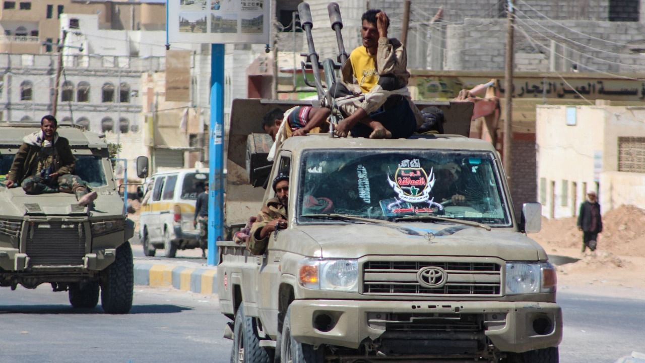 Yemeni pro-government fighters from the UAE-trained Giants Brigade, drive trhough Ataq city, east of the Red Sea port of Aden, on their way to the frontline facing pro-Iran Houthi fighters. Credit: AFP Photo