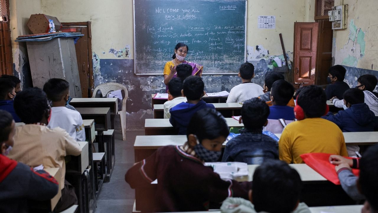 Students attend class in a school after they reopened amidst the spread of the Covid-19 pandemic in Mumbai. Credit: Reuters Photo