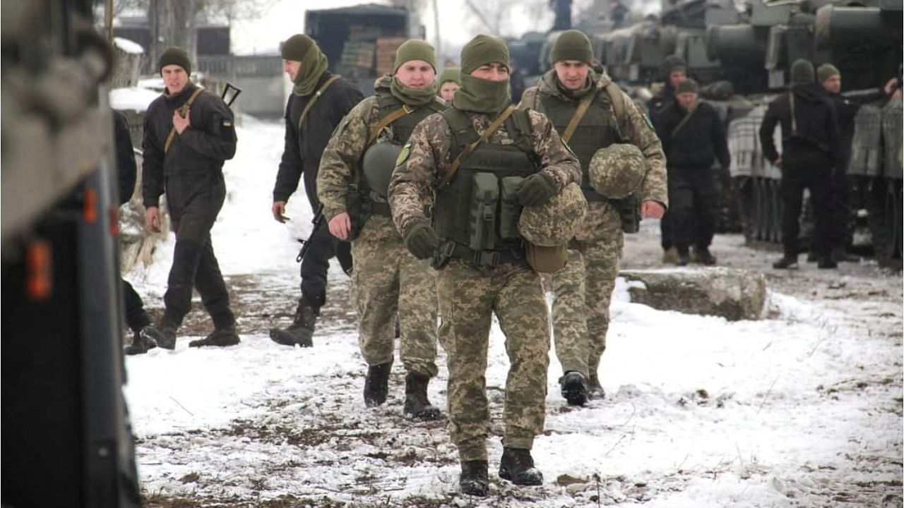 Service members of the 35th Separate Naval Infantry Brigade of the Ukrainian Armed Forces take part in troops deployment drills in Odessa, Ukraine. Credit: Reuters Photo