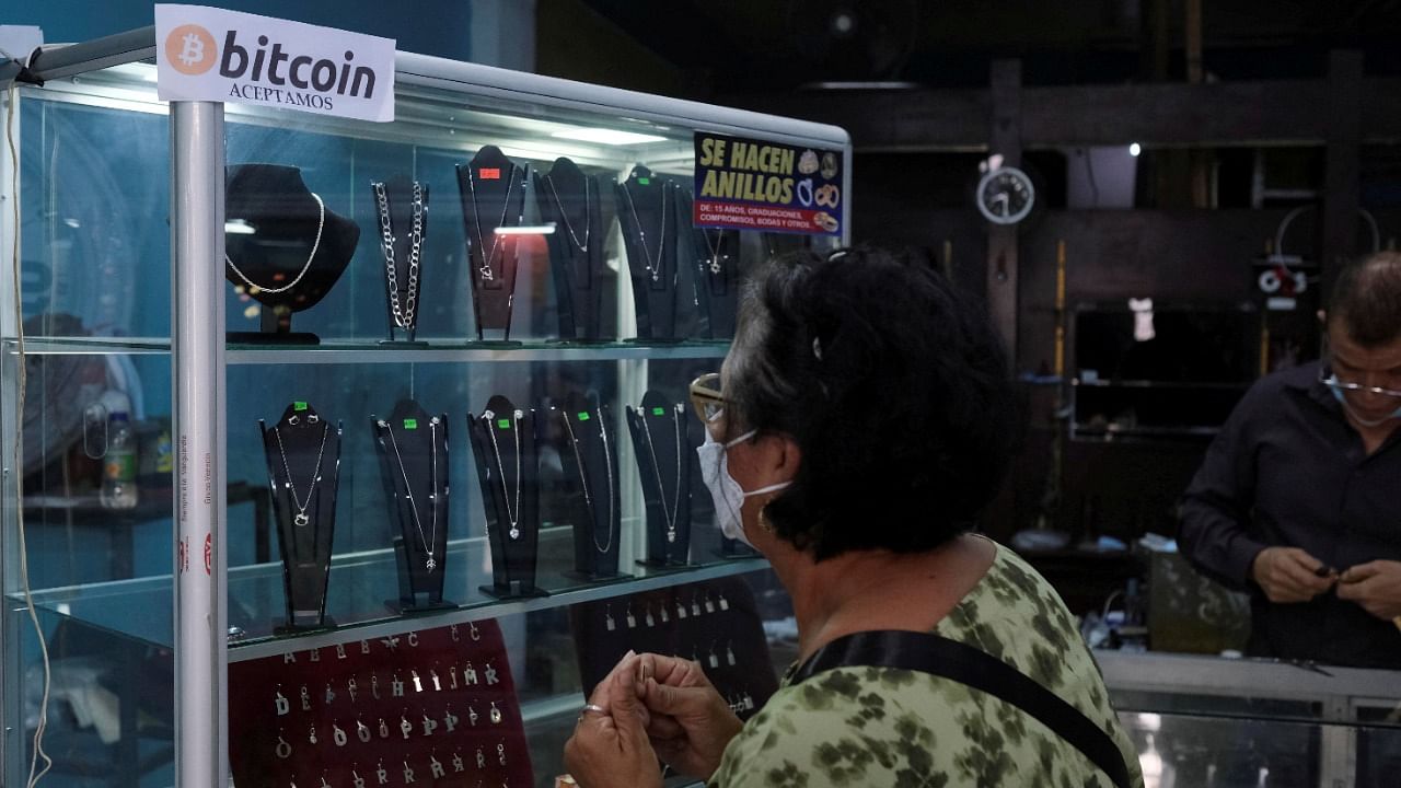 A shop displays a sign stating that bitcoins are accepted. Credit: Reuters File Photo