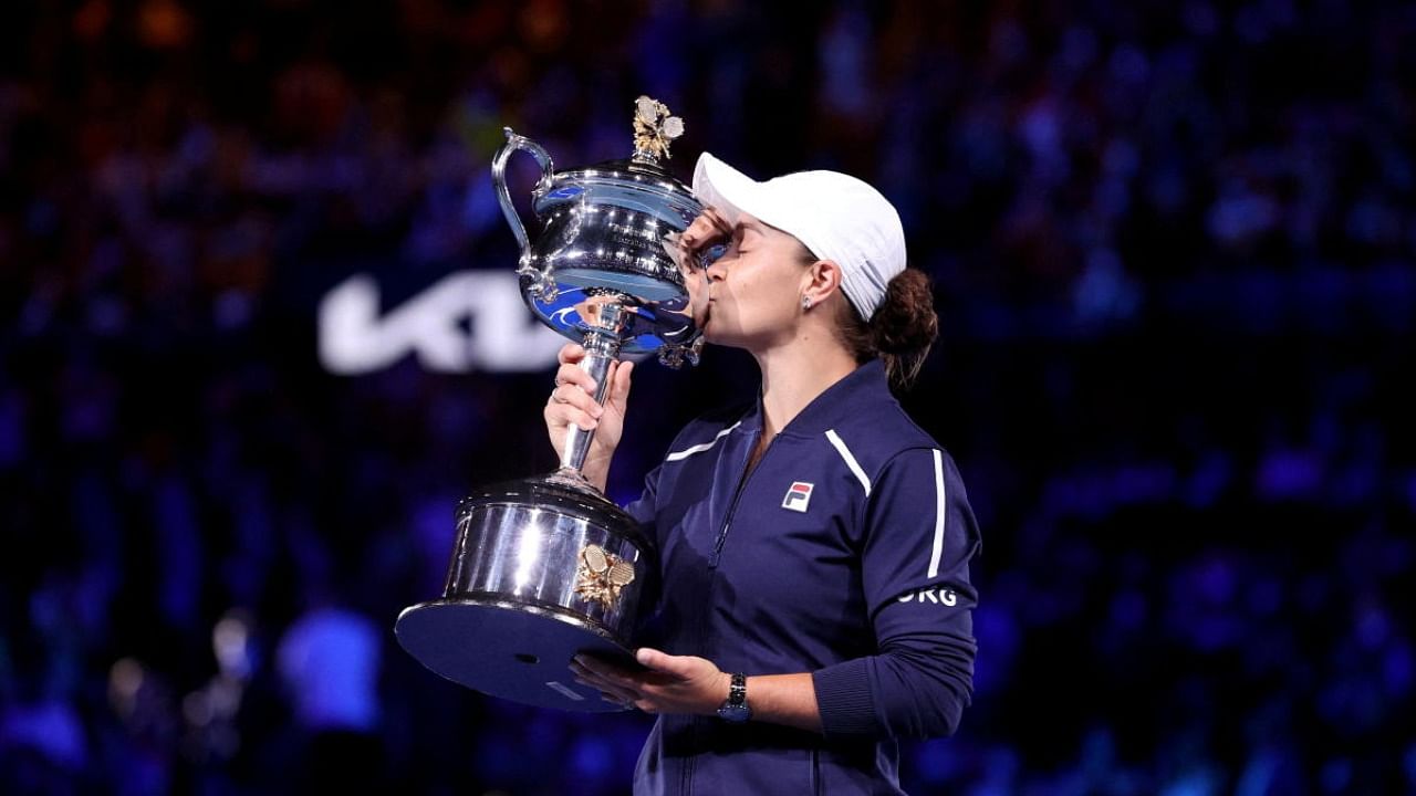 Australia's Ashleigh Barty poses as she celebrates winning the final against Danielle Collins of the US with the trophy. Credit: Reuters Photo