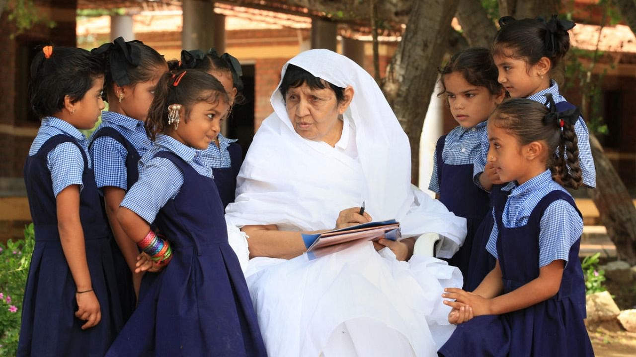Jain Sadhvi Acharya Chandna teaches underprivileged children in Bihar's Rajgir. Chandna has been conferred with the Padma Shri for her contribution to humanitarian work. Credit: PTI Photo