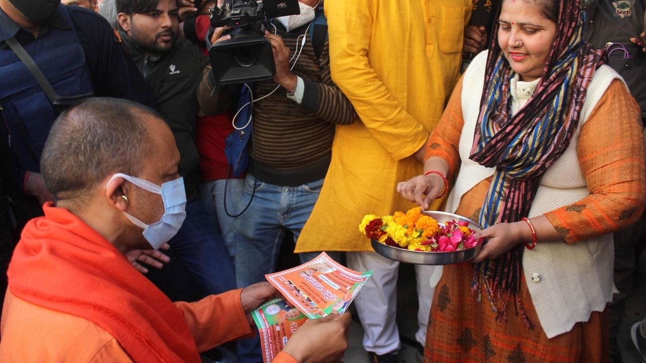 UP CM Yogi Adityanath during door to Door campaign for BJP Meerut Cant. candidate Amit Agarwal for upcoming assembly election at Kankarkhera in Meerut on Friday. Credit: IANS Photo