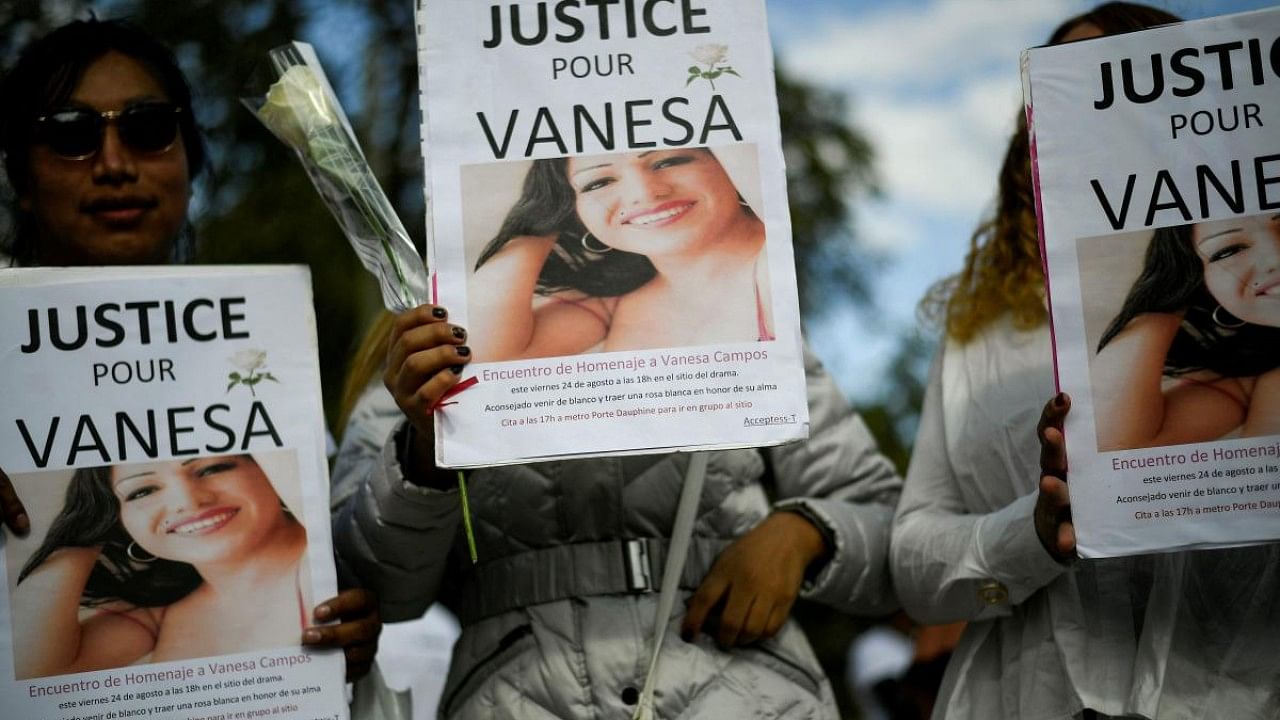 People take part in a march at the Bois de Boulogne in Paris to pay tribute to Vanesa Campos. Credit: AFP Photo