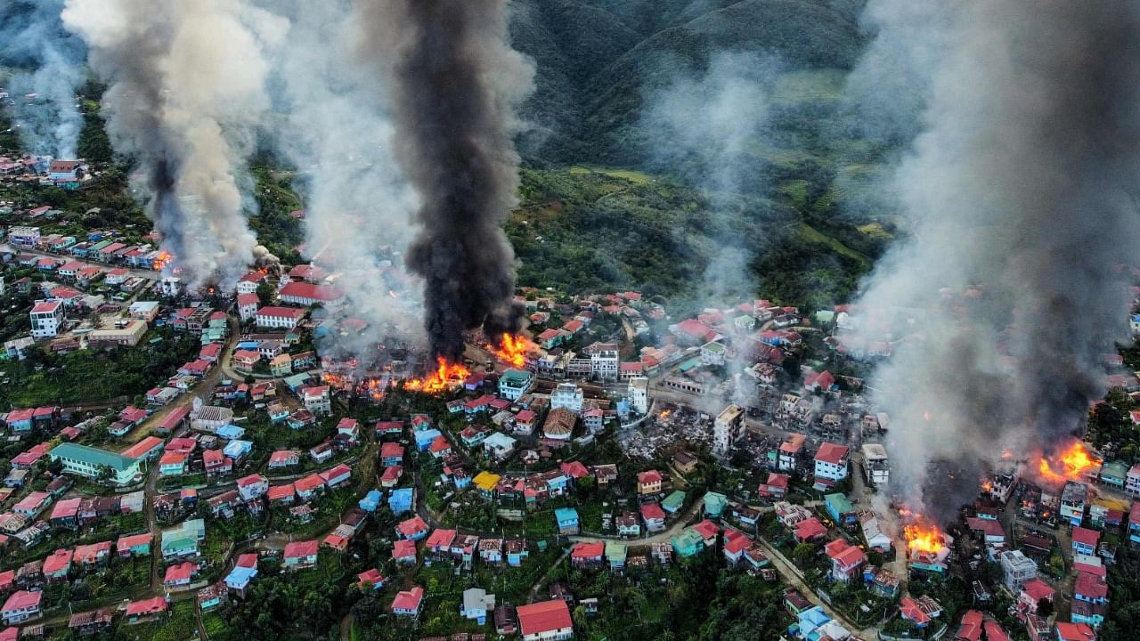 Smoke rises from fires in Thantlang in Chin State, where more than 160 buildings have been destroyed by shelling from junta military troops. Credit: AFP Photo