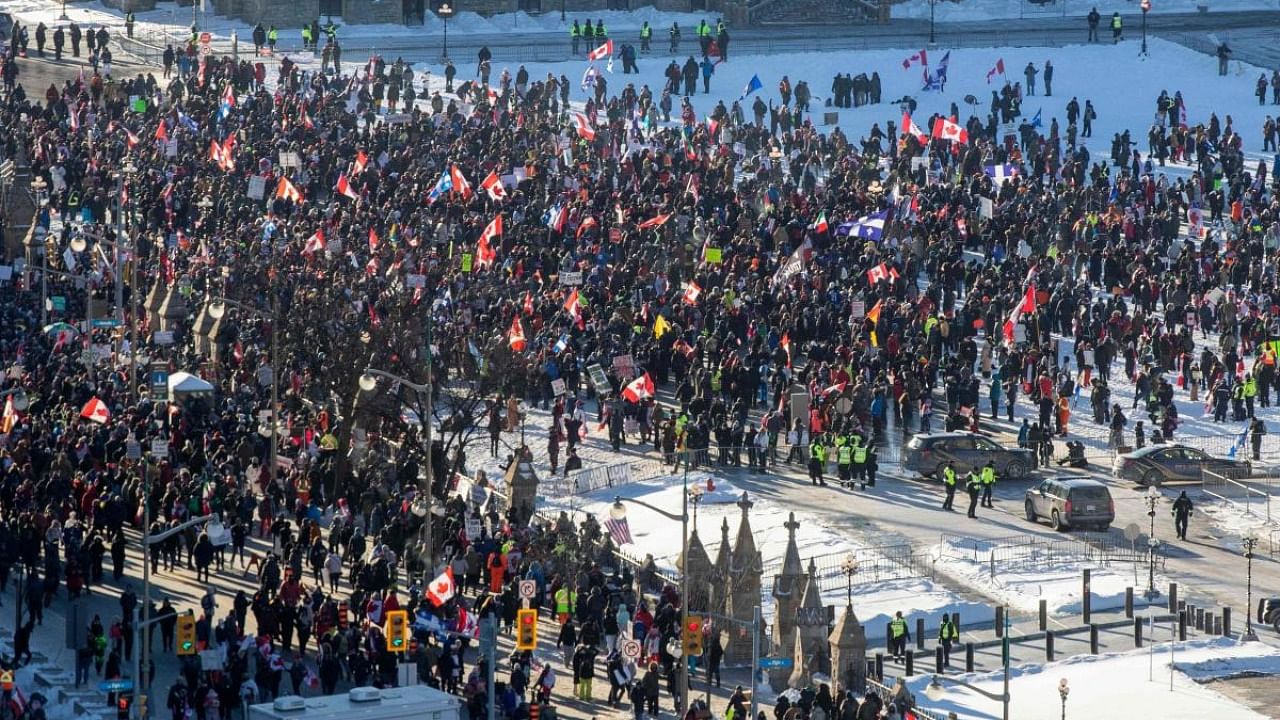 Supporters arrive at Parliament Hill for the Freedom Truck Convoy to protest against Covid-19 vaccine mandates and restrictions in Ottawa, Canada. Credit: AFP Photo
