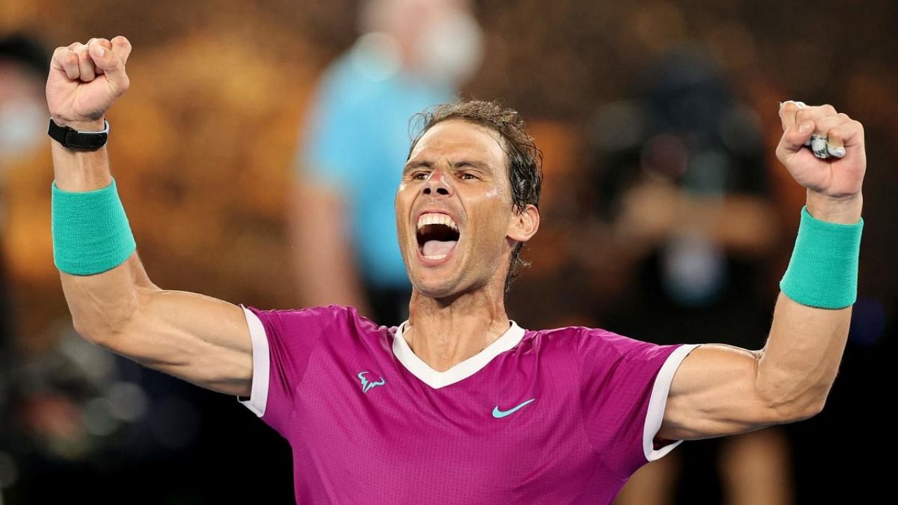 Spain's Rafael Nadal celebrates after winning the men's singles final match against Russia's Daniil Medvedev on day fourteen of the Australian Open tennis tournament in Melbourne. Credit: AFP Photo