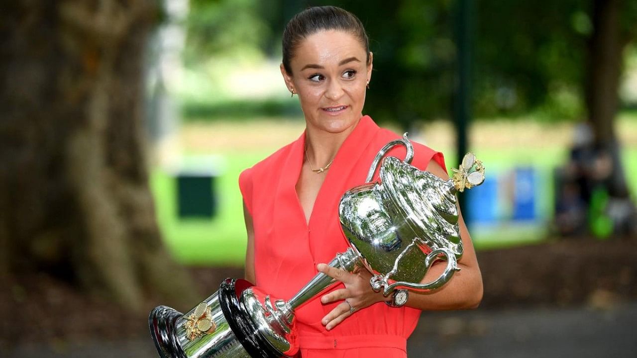 Australia's Ashleigh Barty poses with the 2022 Australian Open winner's trophy. Credit: AFP Photo