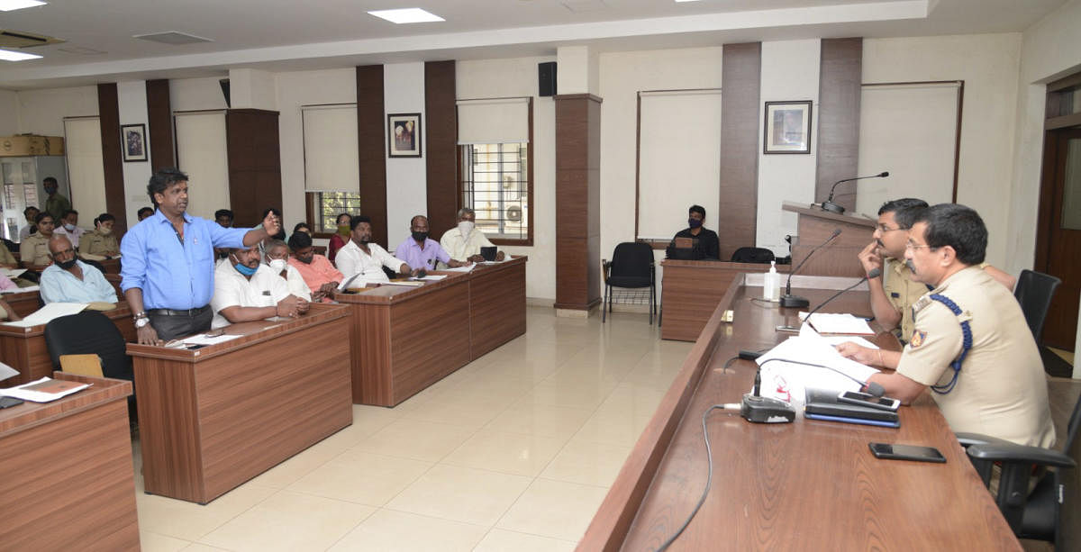 A representative of the SC/ST community airs a grievance at a meeting chaired by DCP Hariram Shankar in Mangaluru.