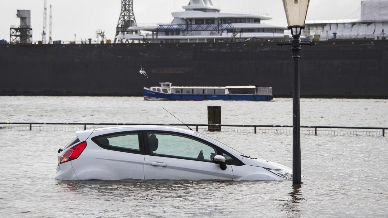 A car is surrounded by flood water in Hamburg, Germany, Sunday Jan. 30, 2022, after a powerful winter storm swept through northern Europe over the weekend. Credit: AP/PTI Photo